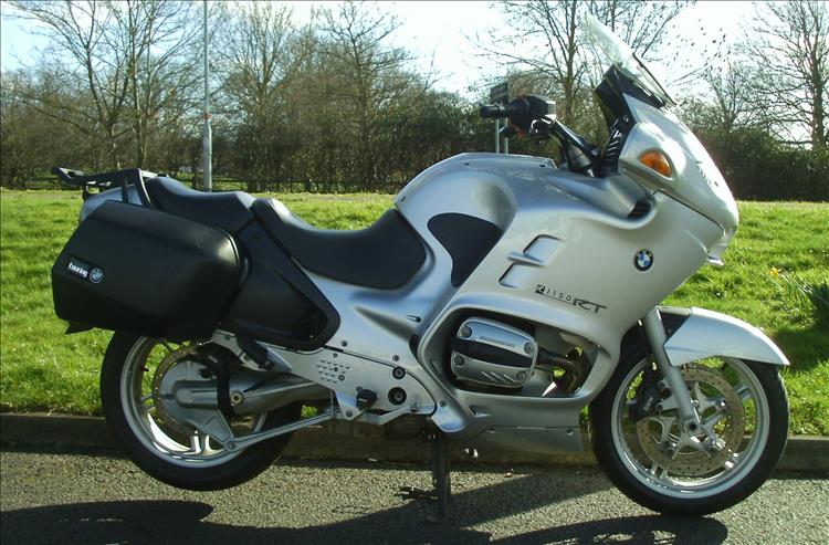 A used but clean and smart BMWR1150RT touring motorcycle, much much bigger than the 250