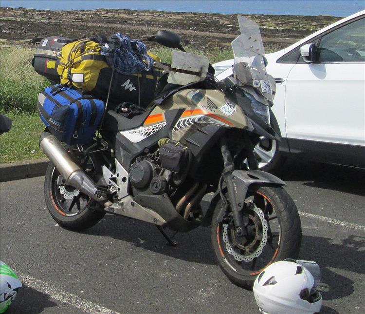 The Honda CB500X buckling under a huge load of bags, throwovers, boxes and kit