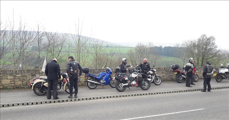 An exclectic collection of motorcycles stopped at the roadside on a ride through Northern Ireland's Sperrin Mountains