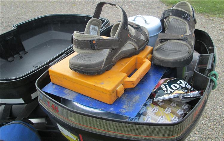 A top box full of sandals and many other things