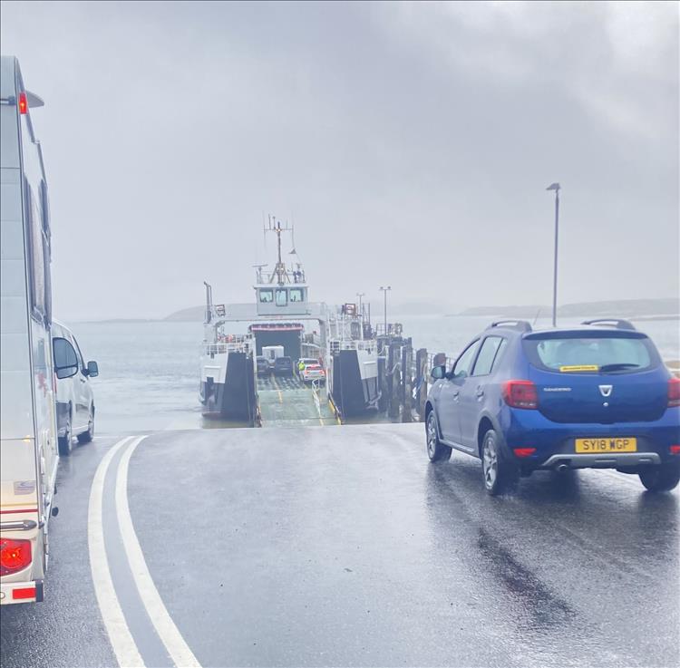 A soaking wet lane leads to the wet and wild ferry crossing on the Scottish Islands