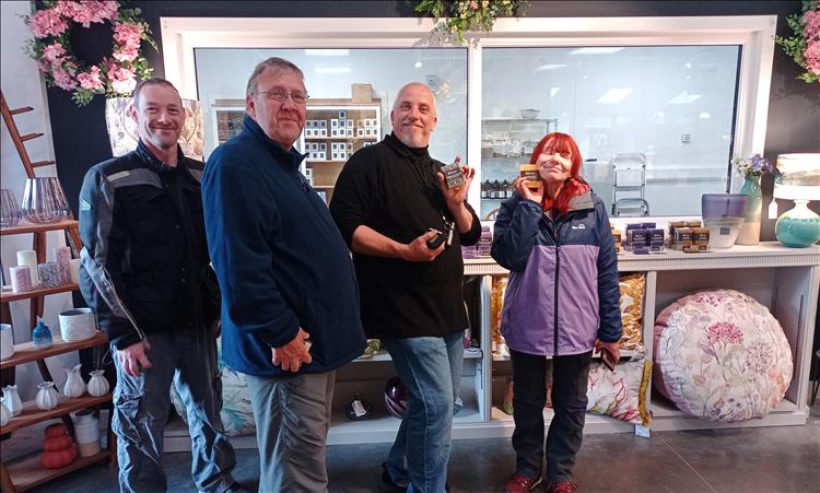 4 bikers in the soap shop all happy with the nice smelling soaps