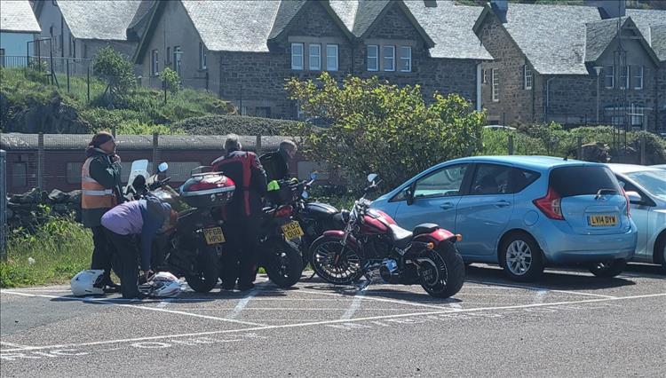 4 bikes and riders parking in the motorcycle parking space at Mallaig