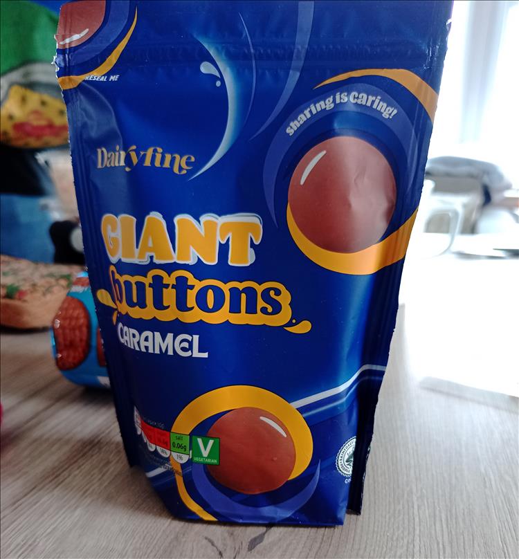 A large packet of cheap own brand chocolate buttons