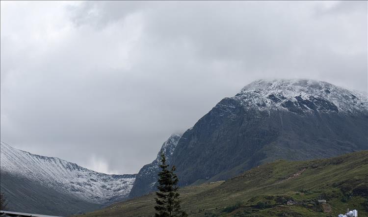 The bulbous top of Ben Nevis covered in snow