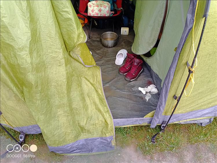 The innder of the tent is soaked and boggy, boots and the like are wet