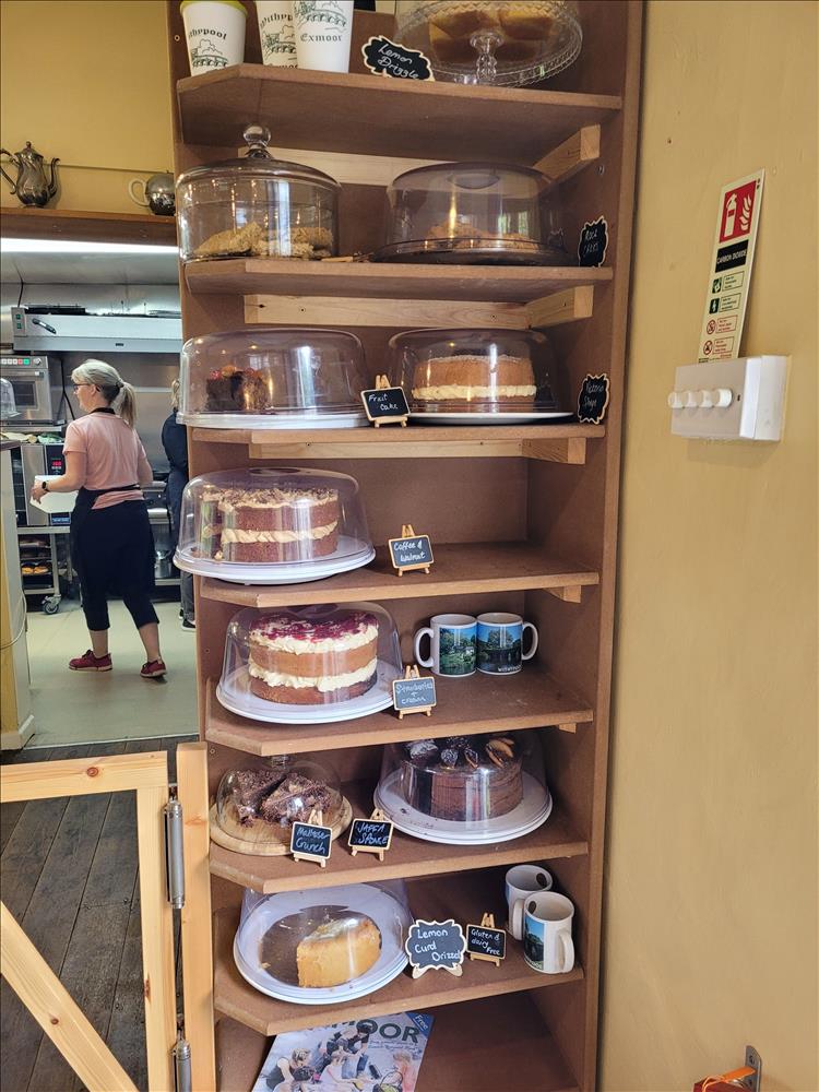 A tall shelf filled with cakes at the tea rooms
