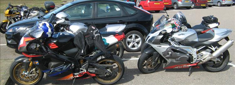 Aprilia RSVs and other fast bikes in a car park