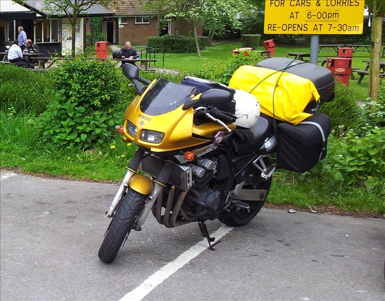 A gold coloured Fazer FZS600 with camping luggage