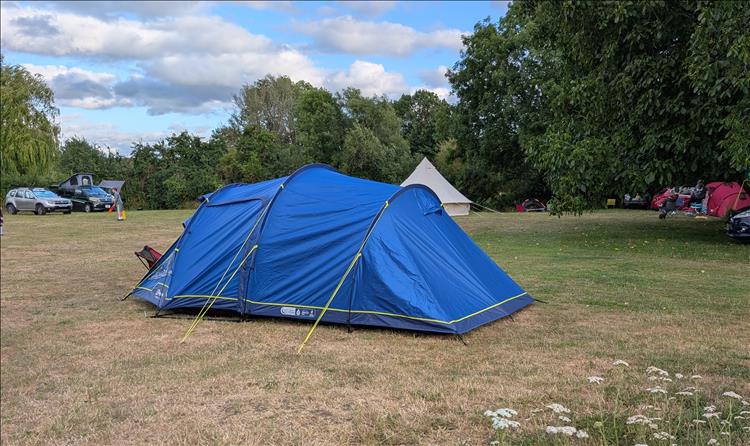 The new tent pitched although the shape is wonky and the material a little baggy