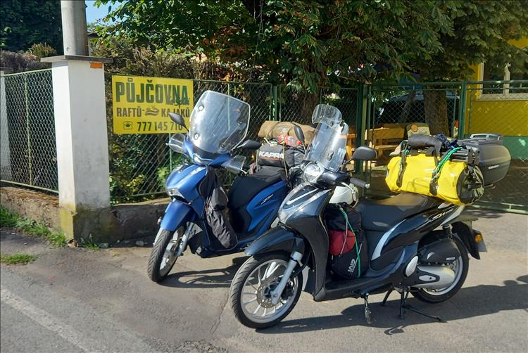 The 2 honda 125 scoots complete with camping gear ready to leave the campsite in Poland