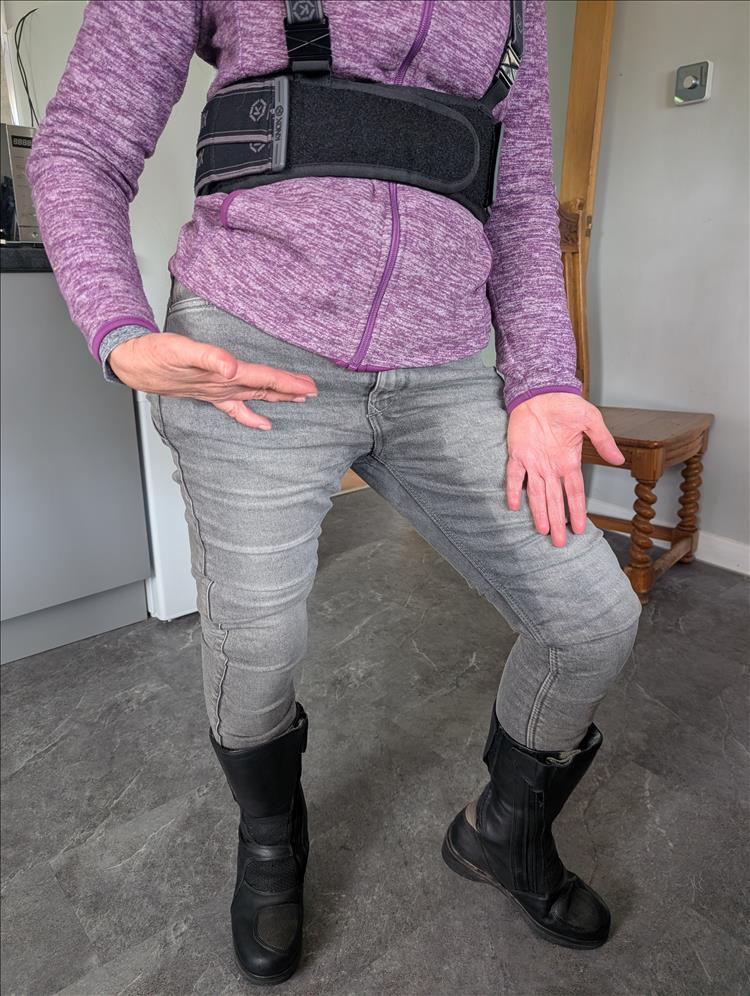 Sharon stands in her wet biker jeans at the bungalow in Kilmarnock