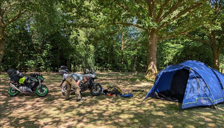 The Z500 and CB500X, the tent and Ren at the campsite in Marlborough