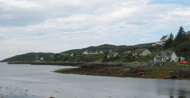 lochinver from the town, houses spread thinly across the loch shore