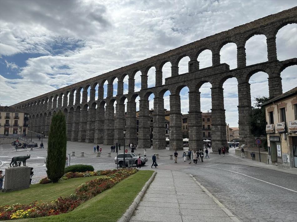 Arches upon arches form a narrow slender and very long bridge of stone
