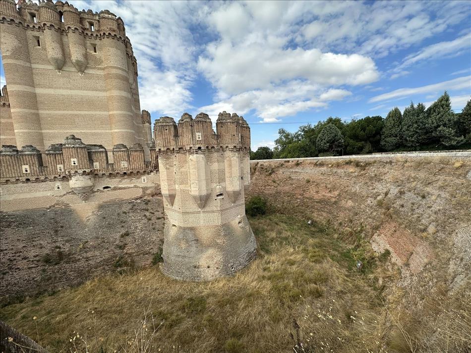 We're close to a tower and the currently dry moat. THe stonework is crisp and fresh