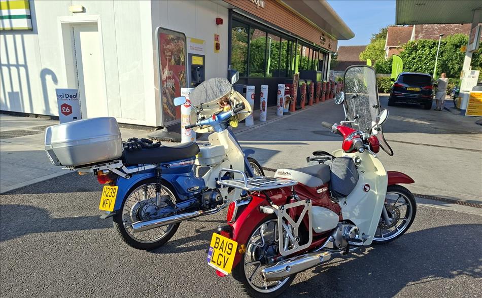Honda C90 and Super Cub 125 at a petrol station