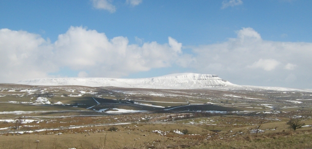 pen-y-ghent, a snow covered hill near horton in ribblesdale
