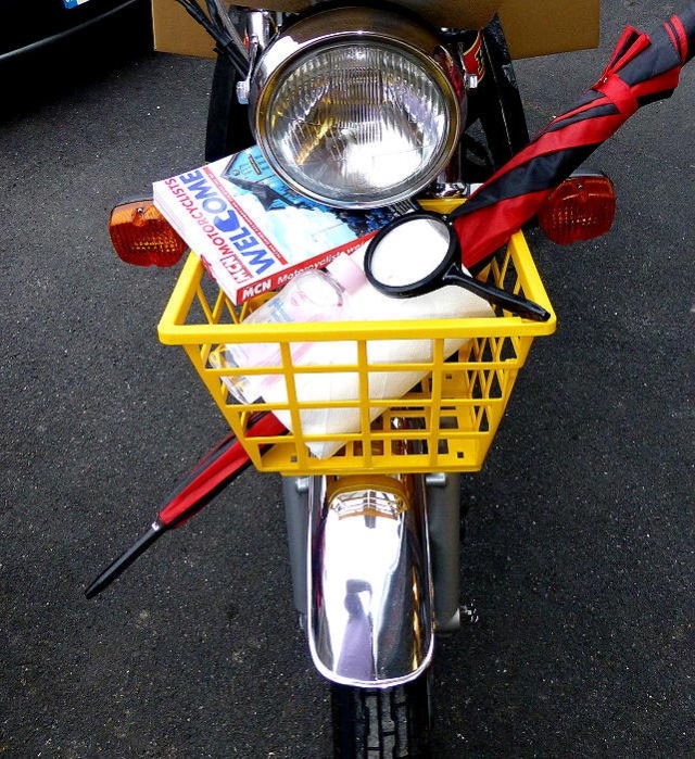 motorcycle with shopping basket attached to front