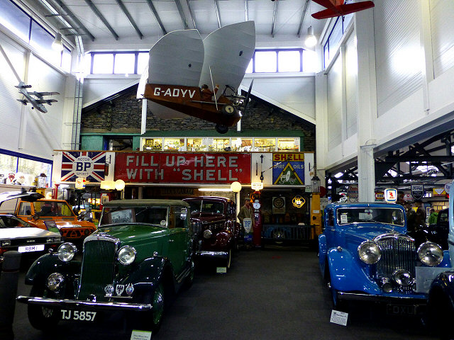 displays of old car, planes, signs and flags at the lakeland motor museum