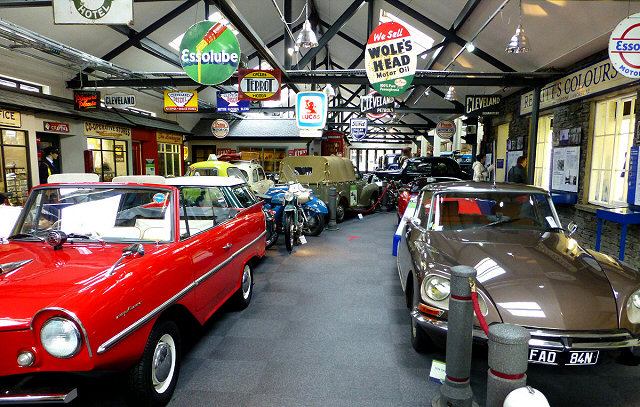 vintage cars in 2 rows at the museum