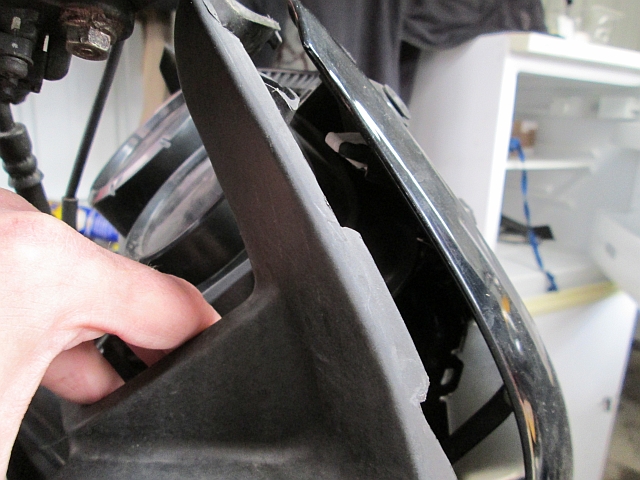 pulling the fairing trim panel away from the front of the fairing