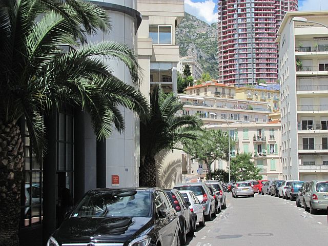 narrow cramped streets with cars parked either side amidst tall cramped buildings in monaco