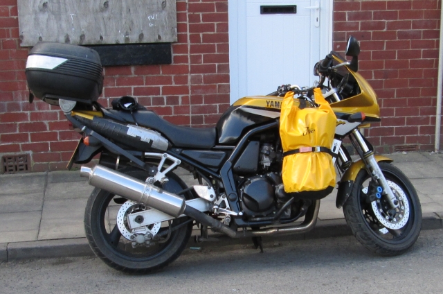 fazer 600 with front bags in bright yellow either side of the engine