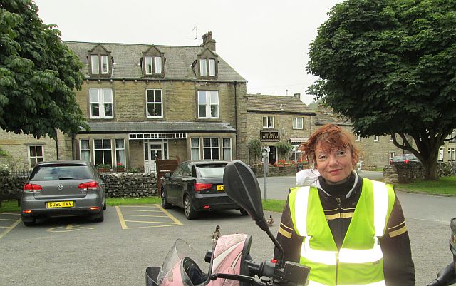 the gf with wry smile outside the cafe at kettlewell in the dales