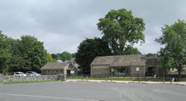 the national park centre and toilets in grassington, stone buildings behind a car park