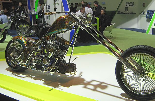 custom motorcycle with massive raked out forks and crazy paintwork