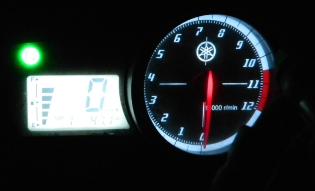 motorcycle clocks shining in the dark night