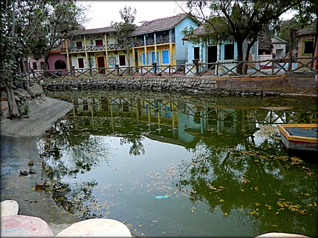 indian houses around a pond