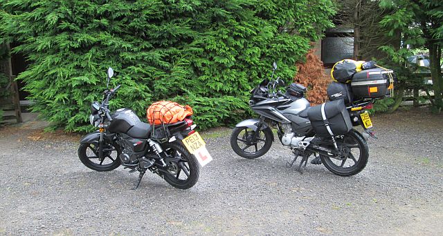 my cbf 125 overladen with camping gear and the gf's RKS 125 with a bag.