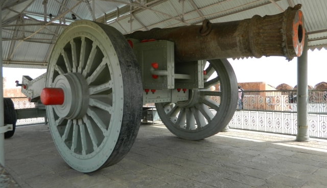 large old canon on wooden wheels