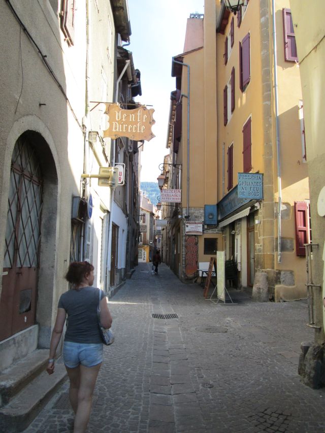 the gf walking down a narrow typically french street