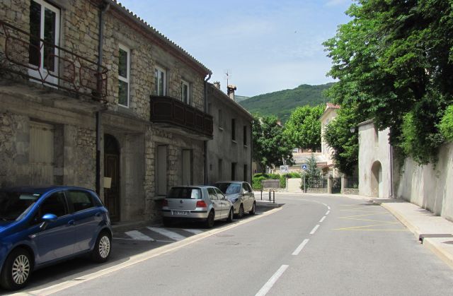 stone built houses in the green countryside on the road to millau