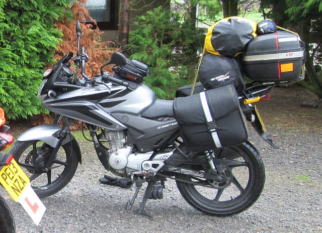 the tent loaded on the back of the cbf 125