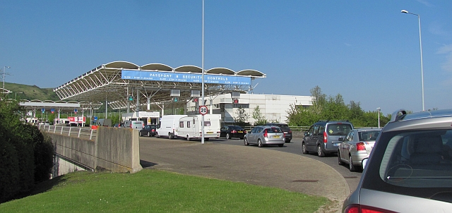 a line of vehicles waiting at passport control for the chunnel