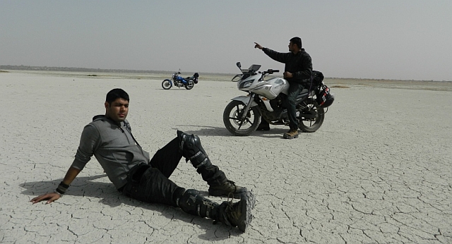 2 friends posing on their motorcycles at sambhar lake
