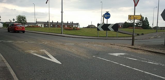 a road junction with the strange porridge type spillage across the road and markings