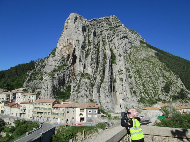 large rock formation with houses at the foot at sisteron france