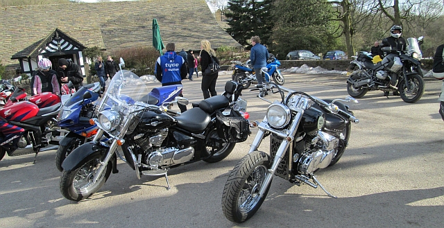 2 shiny cruiser style motorcycles on the car park at rivington barn