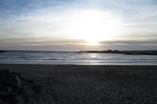 sunset amidst light clouds over trearddur bay anglesey north wales