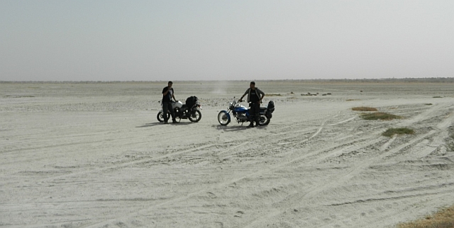 2 bikes and riders, irrelevant in the expanse of the salt lake