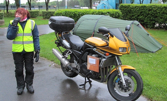 the gf standing next to the fzs600 and tent at the campsite in epernay