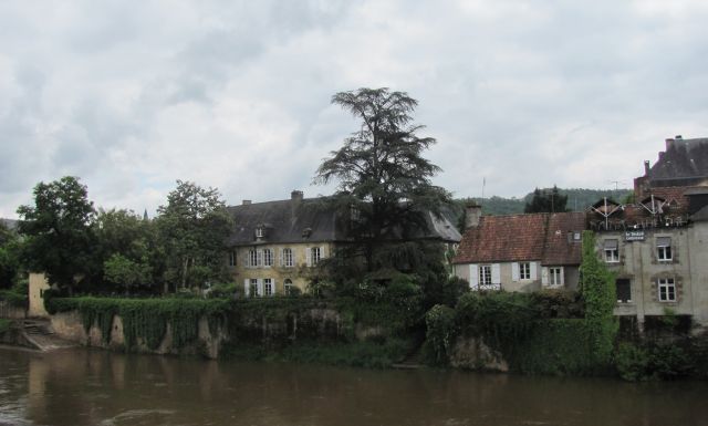 Montignac and old french houses along the swollen river