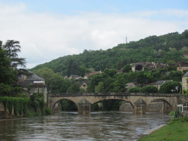 the river Vezere swollen and muddy from the torrential rains