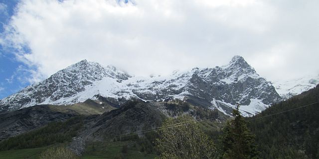 2 snow capped mountain peaks in the french alpine region