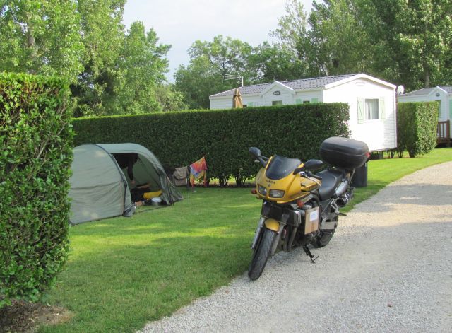 the motorcycle and trusty tent on a smart private pitch at les rioms